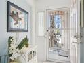 Inviting foyer featuring elegant decor, creating a warm and welcoming atmosphere upon entry at 732 Ramirez Ave, The Villages, FL 32159