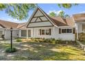 Charming single-story home featuring a brick facade, shuttered windows, and a well-manicured lawn at 8814 Sw 93Rd Ln # B, Ocala, FL 34481