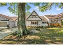 Charming single-story home featuring a brick facade, shuttered windows, and a well-manicured lawn at 8814 Sw 93Rd Ln # B, Ocala, FL 34481