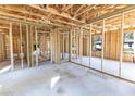 Interior view showcases the home's wooden framework and concrete slab ready for customization at Lot 3 Indian Estates Cr 423, Lake Panasoffkee, FL 33538