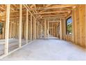 Spacious interior displays unfinished wooden framing, a bright space with a solid foundation at Lot 3 Indian Estates Cr 423, Lake Panasoffkee, FL 33538