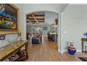 View of the spacious living room showcasing hardwood floors and an open floor plan at 16200 E Shirley Shores Rd, Tavares, FL 32778