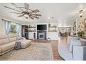 Bright living room features modern furniture, fireplace, and open layout, creating an inviting space at 602 Cr 489, Lake Panasoffkee, FL 33538