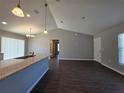 Spacious kitchen with an island featuring stainless steel appliances and modern lighting at 15010 Sw 29Th Ave Road, Ocala, FL 34473