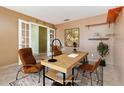 Home office features stylish decor, comfortable seating, and a functional workspace at 1307 Rain Forest Ln, Minneola, FL 34715
