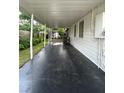Spacious carport area with ample room and a view of the backyard at 1414 Margate Ave, Orlando, FL 32803