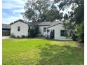 This is a charming single-story home with a well-manicured lawn at 1414 Margate Ave, Orlando, FL 32803