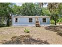 Charming one-story home featuring a well-lit front entrance and traditional window shutters at 300 Carol Ann Dr, Edgewater, FL 32132