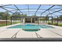 Beautiful pool area with a covered lanai perfect for outdoor relaxation and entertaining at 3055 Wolf Branch Rd, Mount Dora, FL 32757
