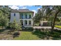 Elegant two-story home featuring classic architectural details and a welcoming front entrance at 6905 Clayton St, Mount Dora, FL 32757