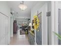 Bright foyer with neutral paint and decorative details, leading into the living area at 1140 Eureka Mill Run, The Villages, FL 32162