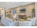 Inviting living room with modern décor, comfortable seating, and an entertainment center at 13304 Magnolia Valley Dr, Clermont, FL 34711