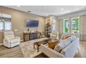 Cozy living room with modern furnishings, plush seating, and lots of natural light at 13304 Magnolia Valley Dr, Clermont, FL 34711