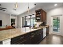 Open kitchen featuring granite countertops, stainless steel appliances, and a breakfast bar at 1893 Banning Beach Rd, Tavares, FL 32778