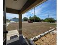View from the porch showcasing the expansive front yard and neighborhood at 222 Locust Ln, Ocala, FL 34471