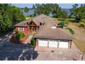 Expansive aerial view of the home showcasing the large property and beautiful lake views at 2400 N Griffin Dr, Leesburg, FL 34748