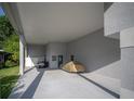 View of the carport with a golf cart and a car covered, offering ample parking and storage space at 2539 Caithness Way, Clermont, FL 34714