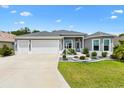 Charming single-Gathering home with a three-car garage, complemented by a well-maintained lawn at 6988 Lawrenceville Way, The Villages, FL 34762