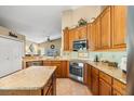 A spacious kitchen with granite counters, stainless appliances, and ample cabinet space for the home chef at 7685 Lake Angelina Dr, Mount Dora, FL 32757