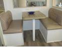 Cozy dining nook with booth seating and a laminate table, perfect for casual meals at 1014 Dustin Dr, Lady Lake, FL 32159