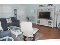 Cozy living room with modern furniture, stylish decor, and a bright, airy atmosphere at 1310 Jimenez Ct, The Villages, FL 32159