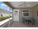 Cozy screened patio area with outdoor seating, perfect for relaxing and enjoying the fresh air at 2296 Whisper St, The Villages, FL 32162