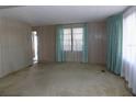 Cozy living room with ample space and natural light at 323 Hawthorne Blvd, Leesburg, FL 34748