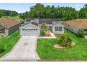 Charming home with well-manicured lawn, a two car garage, solar panels and inviting curb appeal at 3534 Auburndale Ave, The Villages, FL 32162