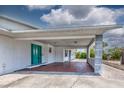 Charming front porch and green door that provides access to the home at 5339 Kings Ct, Fruitland Park, FL 34731