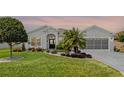 Charming single story home featuring meticulously maintained landscaping, creating a welcoming curb appeal at 5818 Greenbriar Loop, Leesburg, FL 34788