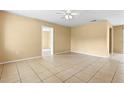 Spacious living room featuring tile floors, neutral walls, and ample natural light at 6808 Fern Cir, Leesburg, FL 34748