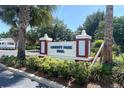 Liberty Park Pool community sign surrounded by vibrant landscaping at 1404 Georgiana Ter, The Villages, FL 32162