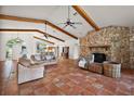 Spacious living area with cozy seating, exposed beams, and lots of natural light at 27011 Se Highway 42, Umatilla, FL 32784