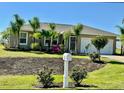 Inviting home exterior with lush landscaping, well-maintained lawn, and cozy curb appeal at 30 Olive Cir, Ocala, FL 34472