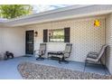 Charming front porch featuring ample seating and decorative elements at 3430 Laurel Dr, Mount Dora, FL 32757
