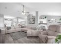 Bright and airy living room featuring a comfortable sectional sofa and modern decor at 36700 Oconee Ave, Eustis, FL 32736