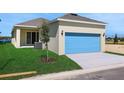 Home exterior features a two-car garage, pristine lawn, and a young shade tree at 5125 Waypointe Blvd, Apopka, FL 32712