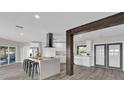 Spacious kitchen features an island with bar stool seating and modern stainless steel appliances at 5526 Parkdale Dr, Orlando, FL 32839