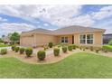 Delightful single-story residence with a charming front garden and a practical two-car garage, offering comfort and style at 5596 Cedar Waxwing Dr, The Villages, FL 32163