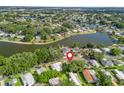 Aerial view of a lakeside community, showcasing the home's prime location near the water at 941 Tarrson Blvd, Lady Lake, FL 32159