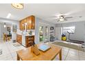 Spacious kitchen area with cabinetry and attached exercise room with treadmill at 9752 County Road 121, Wildwood, FL 34785