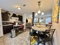 Well-equipped kitchen featuring modern appliances, adjacent dining area, and an open layout at 102 Dogwood Trl, Leesburg, FL 34748