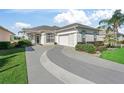 Well-maintained home with a stylish driveway and lush landscaping at 11820 Se 178Th St, Summerfield, FL 34491
