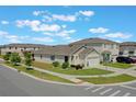 Corner lot view of home, showing adjacent property, manicured lawn, and residential neighborhood at 1548 Planters Point Rd, Kissimmee, FL 34744