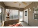 Bright, airy sunroom with abundant natural light and neutral decor for relaxation at 2039 Thurmond Ave, The Villages, FL 32162