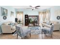Cozy living room with plush seating, stylish decor, and plenty of natural light at 356 Giovani Blvd, Clermont, FL 34715