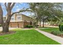 Charming townhome featuring a two-car garage, lush lawn, and inviting landscaping at 866 Ashworth Overlook Dr # B, Apopka, FL 32712