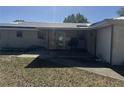 Covered patio area with access to the yard at 916 Kentucky St, Haines City, FL 33844