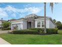 Attractive single-story home with stone accents, well-kept landscaping, and a welcoming front entrance at 1027 Timbervale Trl, Clermont, FL 34715