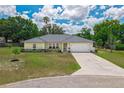 Beautiful home with a lush green lawn, mature trees, and a well-maintained exterior at 111 Ridgeview Cir, Eustis, FL 32726